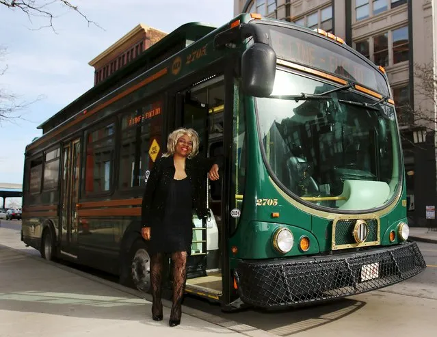 Crystal Hill, a Cleveland regional Transit Authority Trolley driver poses outside her trolley as Tina Turner as part of the Rock and Roll Hall of Fame Induction week in Cleveland, Ohio April 15, 2015. The city of Cleveland has kindly asked its downtown trolley-bus drivers to get in the spirit of this week's 2015 Rock and Roll Hall of Fame induction ceremony and dress up like a rock star, or simply a music great. Drivers can choose from the more than 700 inductees in the Hall of Fame, which holds its 30th ceremony on Saturday. (Photo by Aaron Josefczyk/Reuters)