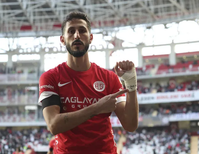 Antalyaspor's Sagiv Jehezkel points a message in his bandage that reads: “100 days. 7.10” as he celebrates after scoring his side's first goal during a Turkish Super Lig soccer match between Antalyaspor and Trabzonspor in Antalya, southern Turkey, Sunday, January 14, 2024. Turkish authorities have detained Turkish top-flight soccer club Antalyaspor's Israeli player Sagiv Jehezkel for questioning after he displayed solidarity with people held hostage by the Hamas militant organization during a league game. (Photo by Adem Akalan/DHA via AP Photo)