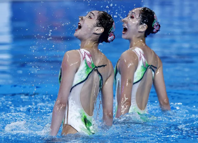 Twin sisters Wang Liuyi and Wang Qianyi took gold for China in the women’s duet technical final at the World Aquatics Championships in Doha, Qatar on February 5, 2024. Kate Shortman and Izzy Thorpe of Great Britain came second. (Photo by Clodagh Kilcoyne/Reuters)