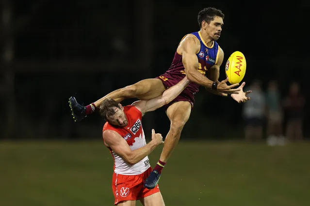 Charlie Cameron of the Lions attempts a mark over Harry Cunningham of the Swans during the 2024 AFL Community Series match between Sydney Swans and Brisbane Lions at Blacktown International Sportspark on February 29, 2024 in Sydney, Australia. (Photo by Cameron Spencer/Getty Images)