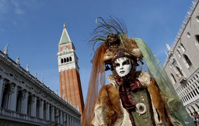 A masked reveller poses during the Venice Carnival in Venice, Italy February 12, 2017. (Photo by Tony Gentile/Reuters)
