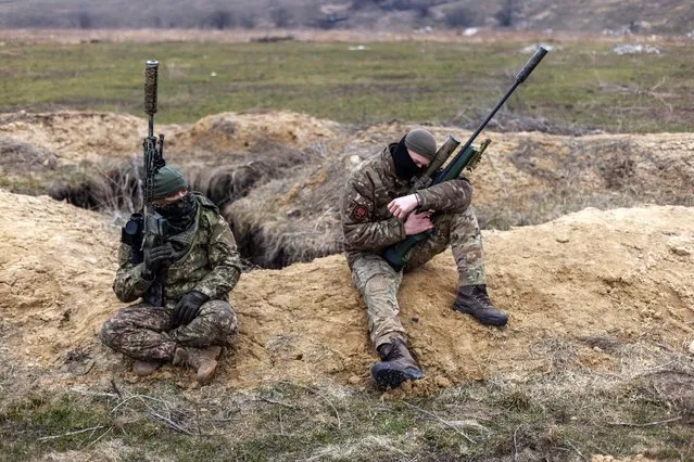 Snipers with the Ukrainian national guard snatch some rest while out on the range in the Donbas region in the last decade of March 2024.(Photo by Jack Hill/The Times)