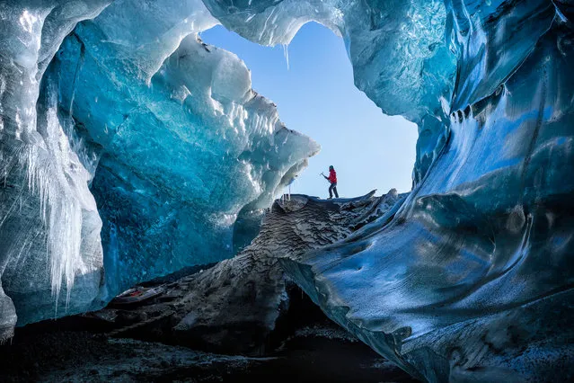 “Winter Cave”. One of the local ice guide guys arriving at a remote ice cave in southeast Iceland. Photo location: Southeast, Iceland. (Photo and caption by Marcelo Castro/National Geographic Photo Contest)