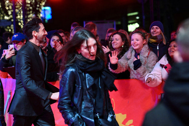 Cast member Adrien Brody is greeted by attendees as he arrives for the screening of the movie “Manodrome” at the 73rd Berlinale International Film Festival in Berlin, Germany on February 18, 2023. (Photo by Annegret Hilse/Reuters)