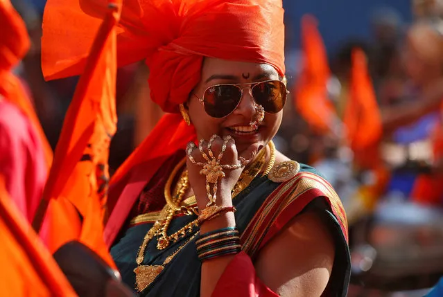 A woman dressed in traditional costume attends celebrations to mark the Gudi Padwa festival, the beginning of the New Year for Maharashtrians, in Mumbai, March 28, 2017. (Photo by Shailesh Andrade/Reuters)