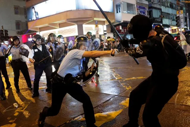 Police clash with anti-extradition bill protesters after a protest, at Tsuen Wan, in Hong Kong, China on August 25, 2019. (Photo by Tyrone Siu/Reuters)