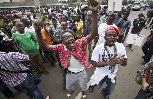 Opposition supporters march, chant, and blow whistles during a protest in Nairobi, Kenya Monday, May 9, 2016. (Photo by Ben Curtis/AP Photo)
