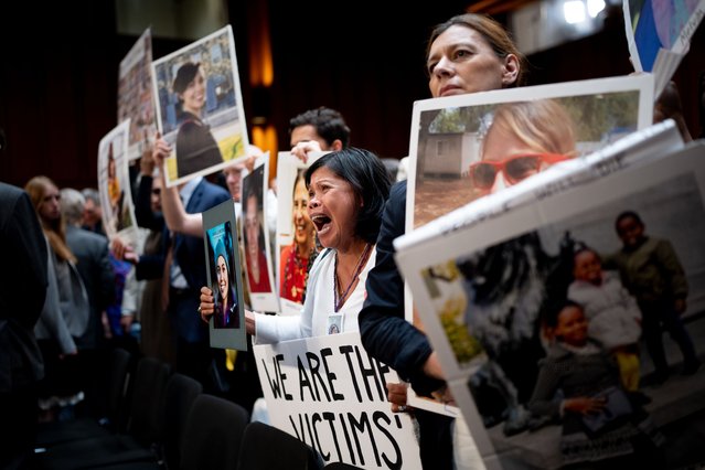 Clariss Moore of Toronto, Canada, holds a photograph of her daughter Danielle Moore and stands with other family members of those killed in the Ethiopian Airlines Flight 302 and Lion Air Flight 610 as she becomes emotional while screaming at Boeing CEO Dave Calhoun as he departs following a Senate Homeland Security and Governmental Affairs Investigations Subcommittee hearing on Boeing's broken safety culture on Capitol Hill on June 18, 2024 in Washington, DC. Calhoun said he is “here to take responsibility” as he testified before the Senate to discuss ongoing quality and safety issues after a new 737 Max 9 airplane's door panel blew out mid-flight during an Alaska Airlines flight in January. (Photo by Andrew Harnik/Getty Images)
