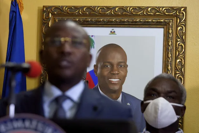 A picture of late Haitian President Jovenel Moise hangs on the wall of his former residence, behind interim Prime Minister Claude Joseph giving a press conference in Port-au-Prince, Tuesday, July 13, 2021. Authorities in Haiti on Thursday forcefully pushed back against reports that current government officials were involved in the July 7 killing of Haitian President Jovenel Moïse, calling them “a lie”. (Photo by Joseph Odelyn/AP Photo)