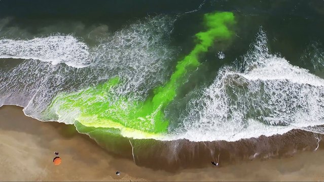 This image provided by NOAA, pictures a harmless green dye used to show a rip current. Rip currents are powerful, narrow channels of fast-moving water that are prevalent along the East, Gulf, and West coasts of the U.S., as well as along the shores of the Great Lakes. About 100 people drown from rip currents along U.S. beaches each year, according to the U.S. Lifesaving Association. (Photo by NOAA via AP Photo)