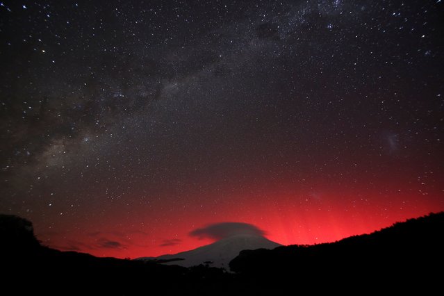 A view shows the lights of an aurora australis caused by a geomagnetic storm over Villarrica volcano, in Pucon, Chile on May 10, 2024. (Photo by Cristobal Saavedra Escobar/Reuters)