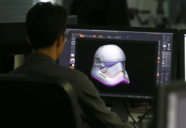A member of the Digital team works on the design of Finn's Stormtrooper helmet from “Star Wars: The Force Awakens”, in the Propshop headquarters at Pinewood Studios near London, Britain May 25, 2016. (Photo by Peter Nicholls/Reuters)