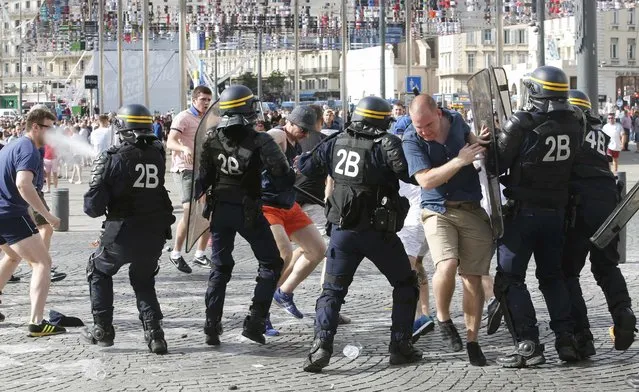 Football Soccer, Euro 2016, England vs Russia, Group B, Stade Velodrome, Marseille, France on June 11, 2016. Police break up a fight between rival supporters at the old port of Marseille before the game. (Photo by Jean-Paul Pelissier/Reuters)