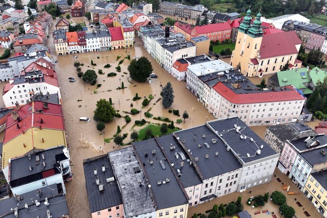 This aerial photograph taken on September 15, 2024 shows a view of the flooded city center in Glucholazy, southern Poland. (Photo by Sergei Gapon/AFP Photo)