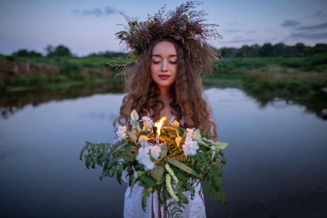 Ukrainians prepare to celebrate Ivana-Kupala in Richmond Park, London on July 6, 2023. Ivana Kupala Day, also known as Ivana-Kupala or Kupala Night, is a traditional pagan holiday folk celebration in eastern Slavic cultures. Girls create and wear flower wreaths and perform various rituals. Initially, Ivana-Kupala was a pagan fertility rite that was also connected to the celebration of the summer solstice when nights are the shortest. After Christianity arrived, the rites were intertwined with the Christian feast of the Nativity of John the Baptist. (Photo by Guy Corbishley/Alamy Live News)