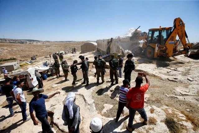 Israeli troops demolish sheds belonging to Palestinians near the West Bank village of Yatta, south of Hebron June 19, 2016. (Photo by Mussa Qawasma/Reuters)