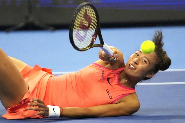 Zheng Qinwen of China returns a shot to Karolina Muchova of the Czech Republic in a women's singles semi-final match, of the China Open tennis tournament, at the National Tennis Center in Beijing, Saturday, October 5, 2024. (Photo by Achmad Ibrahim/AP Photo)