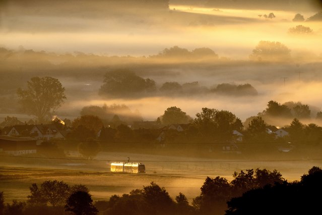 A regional train approaches the station of Wehrheim near Frankfurt, Germany, early Sunday, May 26, 2024. (Photo by Michael Probst/AP Photo)