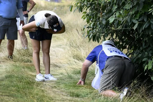 In Gee Chun, of South Korea, left, looks for her ball in the rough on the 16th hole during the third round in the Women's PGA Championship golf tournament at Congressional Country Club, Saturday, June 25, 2022, in Bethesda, Md. (Photo by Nick Wass/AP Photo)
