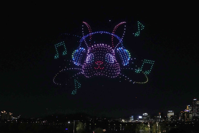 Drones light up the night sky during a drone light show at a park along the Han River in Seoul, South Korea, Friday, October 4, 2024. (Photo by Ahn Young-joon/AP Photo)