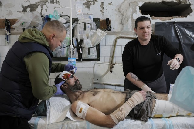 Medical staff give first aid to a wounded Ukrainian soldier near the front line in Donetsk in the second decade of December 2024. (Photo by Oleg Petrasiuk/Ukraine’s 24th Mechanised Brigade/AP Photo)