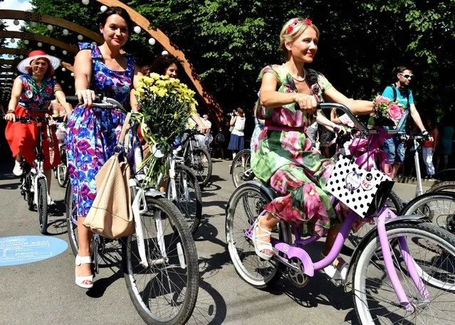 Participants in the Lady on a Bike cycling parade at Sokolniki Park in Moscow, Russia on August 7, 2016. (Photo by Vladimir Vyatkin/Sputnik)
