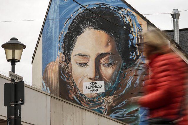 A graffiti, reading “no more feminicide” is sprayed on the wall of a house in Gelsenkirchen, Germany, on the International Day for the Elimination of Violence Against Women, Monday, November 25, 2024. (Photo by Martin Meissner/AP Photo)