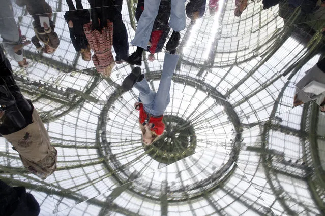 The glass roof of the Grand Palais is reflected on the floor during the Chanel fashion collection during Women's fashion week Fall/Winter 2020/21 presented Tuesday, March 3, 2020 in Paris. (Photo by Thibault Camus/AP Photo)