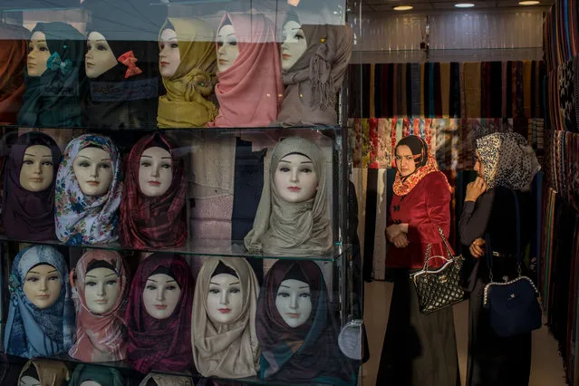 Women shop at a clothing store in East Mosul on November 5, 2017 in Mosul, Iraq. (Photo by Chris McGrath/Getty Images)