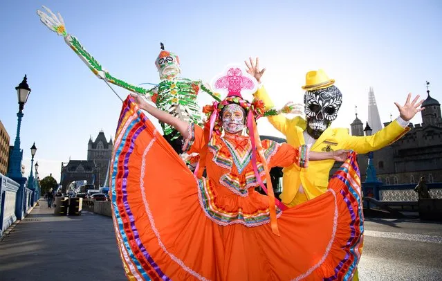 Traditional Mexican parade characters during PATRON's cultural celebration of Dia de Muertos at Tower Bridge in central London on Tuesday, November 1st, 2022. (Photo by Jonathan Hordle/PA Images via Getty Images)
