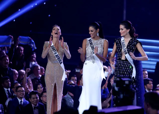 Miss South Africa Demi-Leigh Nel-Peters (L) reacts with Miss Venezuela Keysi Sayago (C) and Miss Thailand Maria Poonlertlarp as she is selected as one of the final three contestants during the 66th Miss Universe pageant at Planet Hollywood hotel-casino in Las Vegas on November 26, 2017. (Photo by Steve Marcus/Reuters)