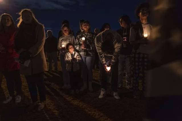 Community members gather for a candlelight vigil at Chesapeake City Park in Chesapeake, Va., Monday, November 28, 2022, for the six people killed at a Walmart in Chesapeake, Va., when a manager opened fire with a handgun before an employee meeting last week. (Photo by Carolyn Kaster/AP Photo)
