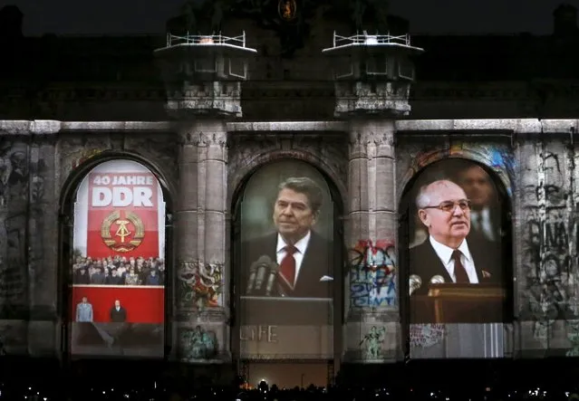 The video mapping "Sounds and Lights of Unity" is projected on the Arcades of Cinquantenaire to celebrate the 25th anniversary of German reunification, in Brussels, Belgium, October 1, 2015. (Photo by Francois Lenoir/Reuters)