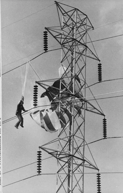 In this October 8, 1978 file photo, 17-year-old Danny Matthews of Irving, Texas is suspended about 60 feet in the air with his parasail caught in a power line. Danny was parasailing, pulled by a truck, when a strong crosswind forced him into the electrical cables. (Photo by Mark Graham/AP Photo)