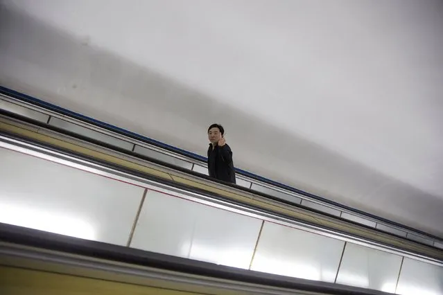 A man gestures as foreign reporters enter a subway station during a government organised tour in Pyongyang, North Korea, October 9, 2015. (Photo by Damir Sagolj/Reuters)