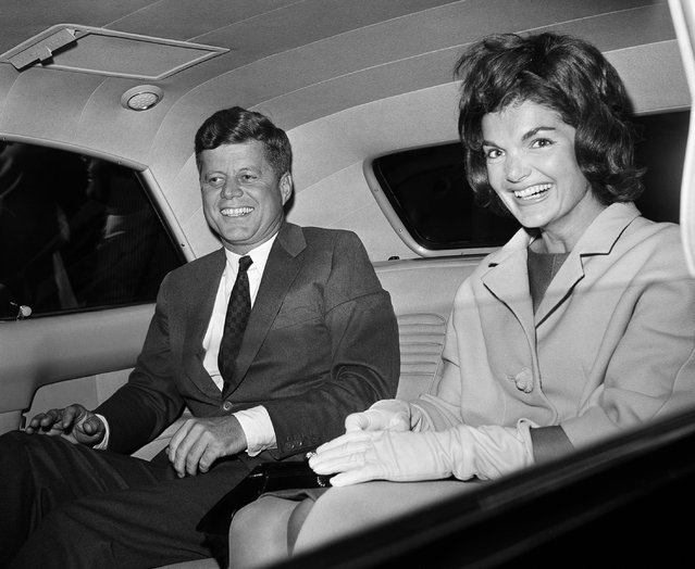 President John F. Kennedy sits with his wife, Jacqueline, after her arrival back from a trip to Greece, as he met her at Washington National Airport on her return, June 15, 1961. (Photo by John Rous/AP Photo)
