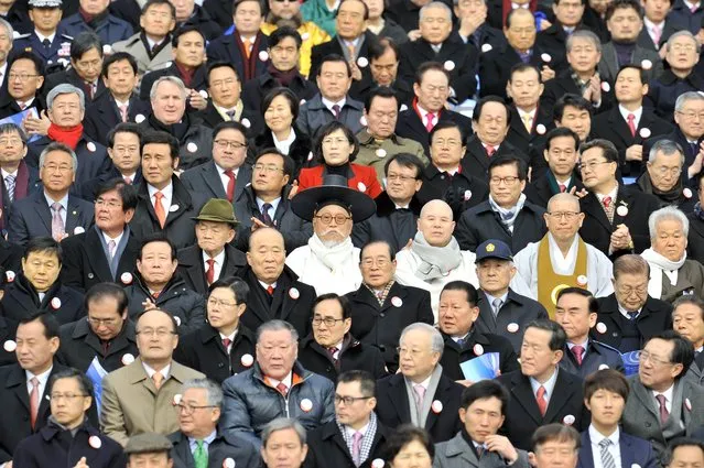 A South Korean elderly man (C) wearing a traditional scholar outfit sits during the presidential inauguration ceremony for South Korea's incoming president Park Geun-Hye at the National Assembly in Seoul on February 25, 2013. Park Geun-Hye was sworn in as South Korea's first female president on February 25, vowing zero tolerance with provocations from a nuclearised North Korea and a new era of economic prosperity for all. (Photo by Jung Yeon-Je/AFP Photo)