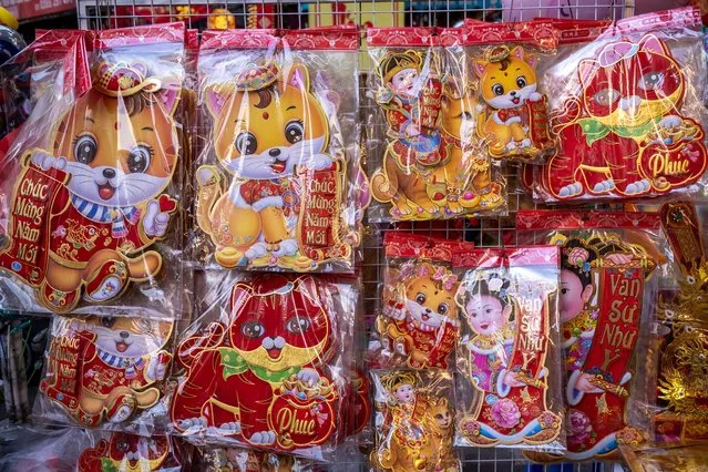 Stickers with cat image are on display at the Spring Festival Fair in the Old Quarter on January 14, 2023 in Hanoi, Vietnam. The Lunar New Year also known as the Spring Festival or Chinese New Year, which is based on the Lunisolar Chinese calendar, falls on January 20 this year and marks the Year of the Cat in Vietnam or the Year of the Rabbit in China, Korea, and other East and Southeast Asian countries. (Photo by Linh Pham/Getty Images)