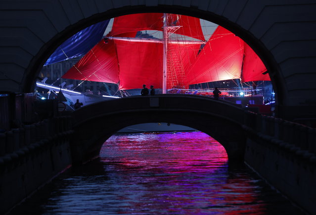 Frigate “Rossiya” (Russia), with scarlet sails, floats on the Neva River during a general rehearsal for the Scarlet Sails celebration in St. Petersburg, Russia, 27 June 2025. The traditional celebration is organized in honor of students from elementary and high schools, as well as military academies, as they finish their educational terms and hold graduation ceremonies in Russia’s second-largest city. (Photo by Anatoly Maltsev/EPA)