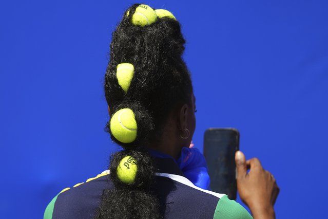 Shaniqua Martin takes a selfie in front of a photo of Coco Gauff during the first round of the US Open tennis championships, Monday, August 25, 2025, in New York. (Phot by Kirsty Wigglesworth/AP Photo)