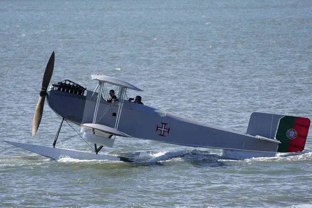 A replica of a Portuguese Navy Fairey III-D seaplane used in the first aerial crossing of the South Atlantic floats on the Tagus river in Lisbon during celebrations of the 100th anniversary of the flight, Sunday, April 3, 2022. Portuguese Navy airmen Carlos Gago Coutinho and Artur de Sacadura Cabral flew from Lisbon to Rio de Janeiro in 1922. (Photo by Armando Franca/AP Photo)