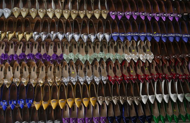 Shoes used with “La Morenada” dance costumes are on display for sale ahead of the annual Feast of the Lord of Great Power in La Paz, Bolivia, Wednesday, May 22, 2024. (Photo by Juan Karita/AP Photo)