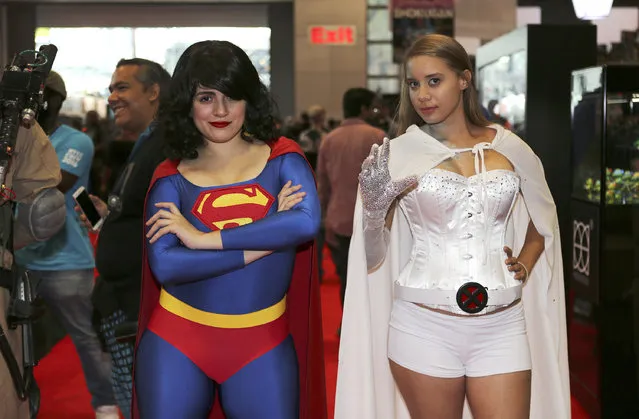 Fans dress up in costume while attending the first day of New York Comic Con at the Javits Center on Thursday, October 6, 2016. (Photo by Steve Luciano/AP Photo)