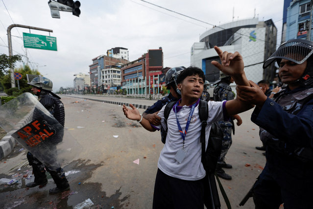 Riot police personnel try to detain a demonstrator during a protest against corruption and the government’s decision to block several social media platforms, in Kathmandu, Nepal on September 8, 2025. (Photo by Navesh Chitrakar/Reuters)