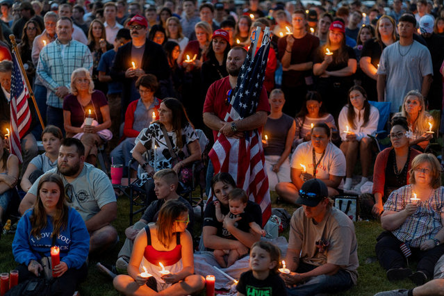 People attend a vigil for Charlie Kirk in Provo, Utah on September 13, 2025. (Photo by Cheney Orr/Reuters)