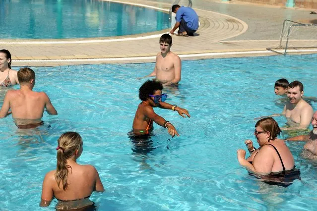 An animator plays handball with tourists in the swimming pool at a hotel at the Red Sea resort of Sharm el-Sheikh, November 7, 2015. (Photo by Asmaa Waguih/Reuters)