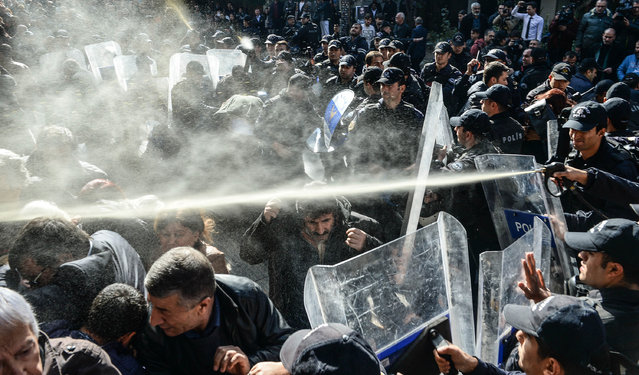 Turkish police spray papper gas as they arrest protestors during a anti-government protest on November 4, 2016 in Ankara, Turkey. Co-leaders of the pro-Kurdish political party Peoples' Democratic Party (HDP) Figen Yuksekdag and Selahattin Demirtas were detained, along with at least other nine members of parliament (MPs), as part of a counter-terrorism investigation following a police raid in the HDP party headquarters. The HDP is accused by the Turkish government to have links with the Kurdistan Workers' Party (PKK) militant group, an accusation HDP strongly denies. (Photo by Getty Images)
