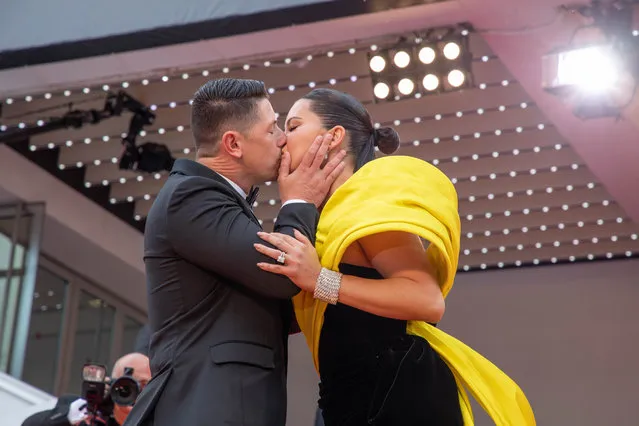 Brazilian model Adriana Lima (R) and her partner US producer Andre Lemmers kiss as they arrive for the screening of the film “Indiana Jones and the Dial of Destiny” during the 76th edition of the Cannes Film Festival in Cannes, southern France, on May 18, 2023. (Photo by Roland Macri/Splash News and Pictures)
