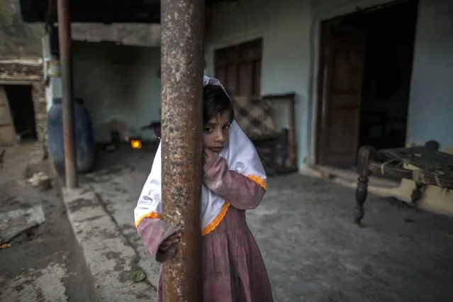 A girl stands at her house on Margalla Hills in Islamabad January 22, 2015. (Photo by Zohra Bensemra/Reuters)