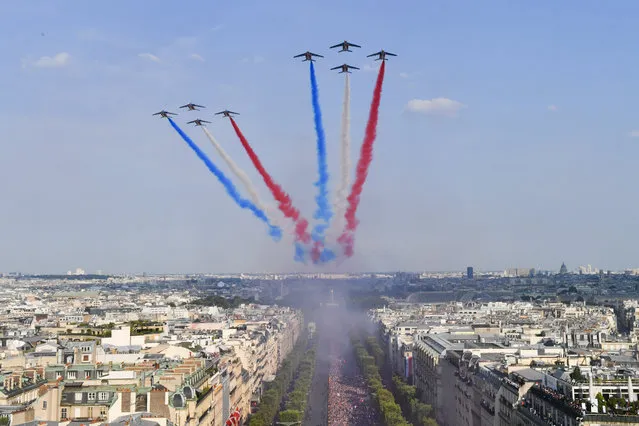 The “Patrouille De France” is seen as the Bus of France's World Cup Winning Team Parade Down The Champs Elysees, on July 16, 2018 at the Champs Elysees in Paris, France. (Photo by Stephane Cardinale/Corbis via Getty Images)